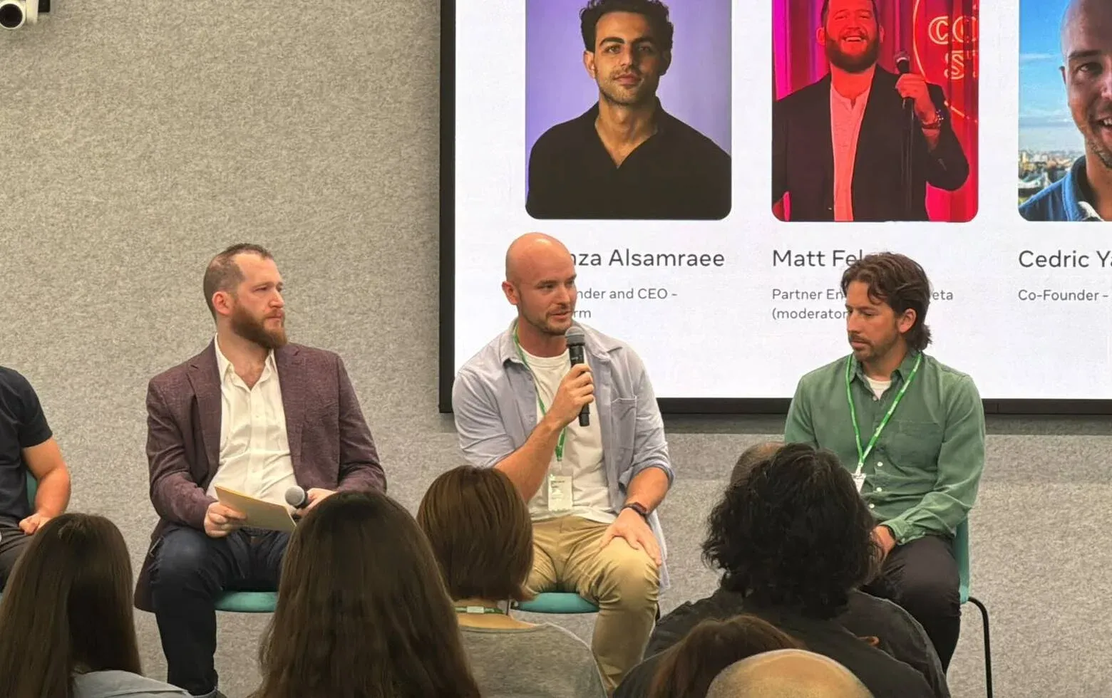 Answering a question on stage, between Matt Felser (Meta) and David Richards (Impact).